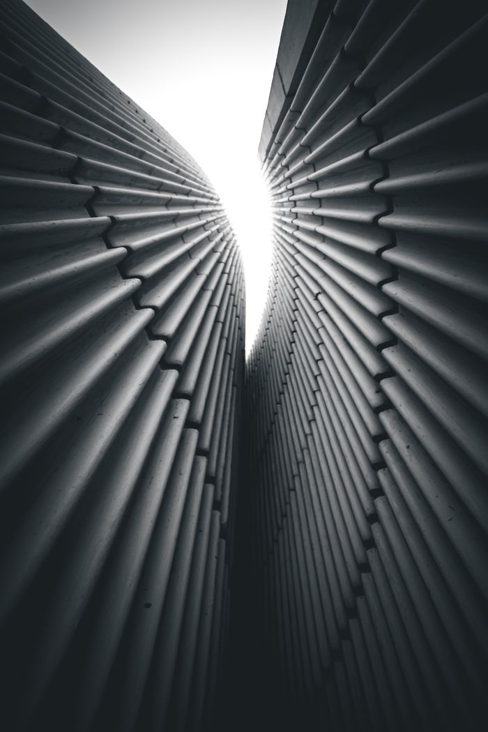 Black and white abstract view of architectural patterns in buildings.